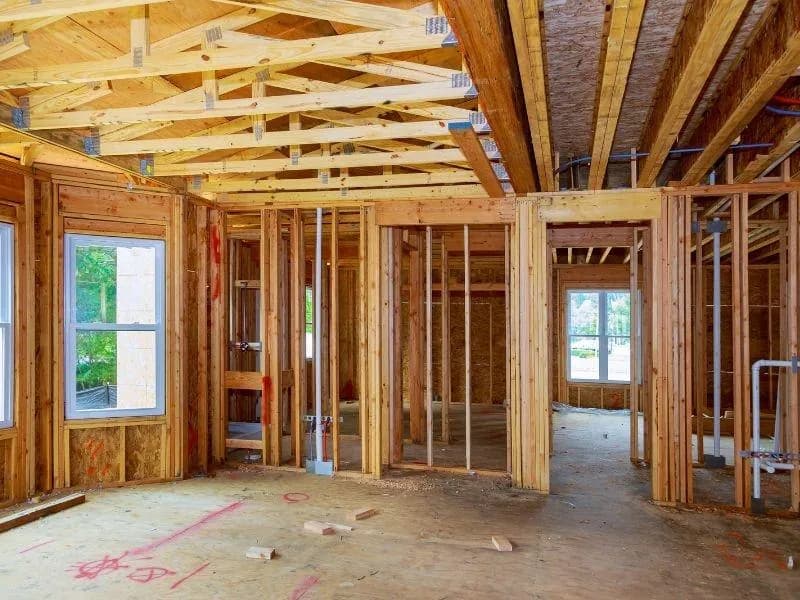 Interior wood wall and ceiling framing inside a building under construction